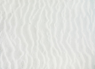 Fototapeta na wymiar waves of white sand background
