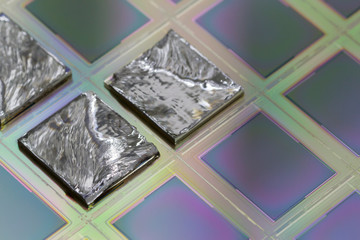 Pieces of polycrystalline silicon integrated on a polysilicon substrate with microchips.