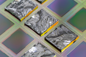 Pieces of polycrystalline silicon integrated on a polysilicon substrate with microchips.