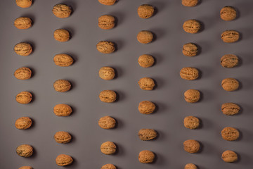 Walnuts on a gray background, flat lay