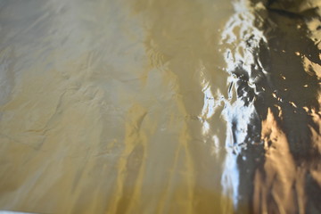 Gloss of aluminum foil in a roll and in sheets.