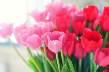 Blurred floral spring background. Bright beautiful tulips. a large bouquet of spring delicate pink flowers