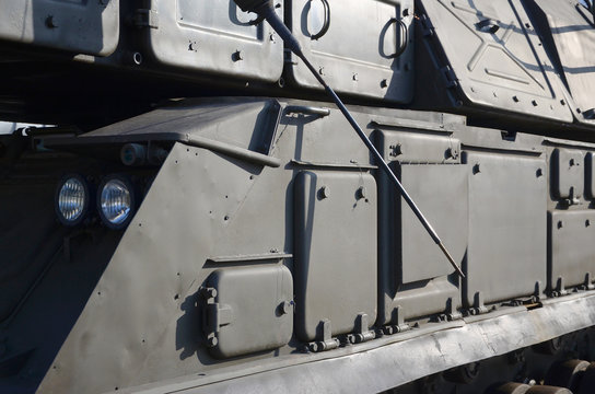 Close up of green armoured caterpillar transport. Modern military transportation vehicle technologies - Powered by Adobe