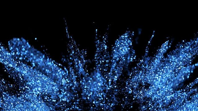 Abstract blue sapphire glitter explosion in slow motion. Bokeh background with shining defocus blurred sparkles. Dust macro close up backdrop with logo copy space and alpha channel. 4k ProRes422