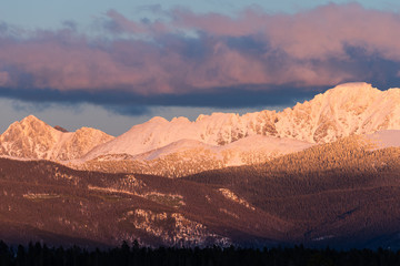 View of Indian Peaks from Fraser Valley Colorado.  The west side of the Indian Peaks at sundown viewed from the Fraser Valley.  The towns of Tabernash and Fraser are below the Indian Peaks.