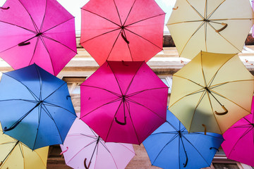 colorful decoration umbrellas on street in old town Avignon