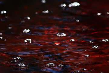 abstract background ripples on water / brown stream, water texture brown color on the swamp, peat