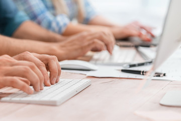 close up. employees work with documents sitting at the table.