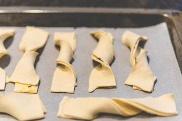 Making cheese stems that just come out of the oven.