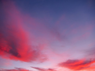 Dark blue sky with red clouds. 