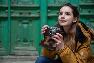 Photo of young tourist girl exploring streets of Baku. Moody photos of teenager girl visiting old city and taking photos of the city