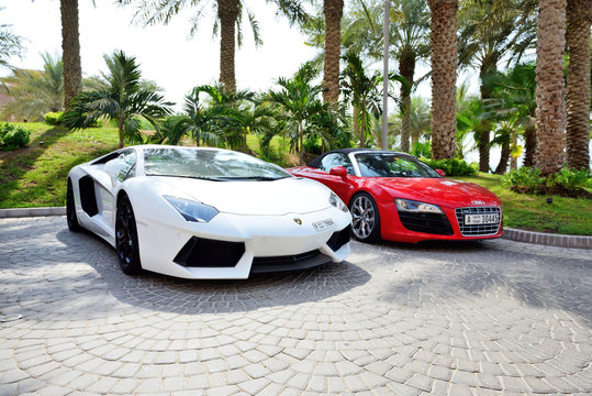 DUBAI, UAE - SEPTEMBER 11: The Atlantis the Palm hotel and luxury sport cars. It is located on man-made island Palm Jumeirah on September 11, 2013 in Dubai, United Arab Emirates