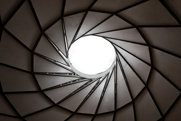 black and white spiral roof pattern visual illusion of movement in a tunnel