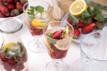  cold strawberry lemonade juice in the glasses with ice cubes