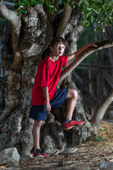 Cute boy posing with sport clothing
