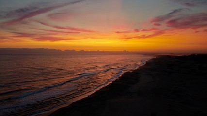 Fototapeta na wymiar Colorful and amazing sunset in the beach