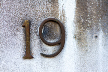 Number 19 set into a wall with the last two digits missing