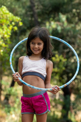 Cute girl posing with hula hoop © Mauro Rodrigues