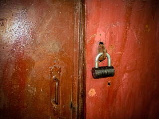 Iron door locked with padlock