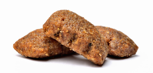 Dog food isolated on white background. Close-up.