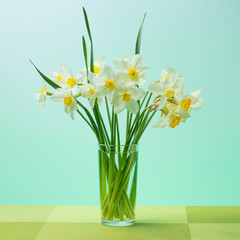 Fototapeta na wymiar Bouquet of spring flowers of daffodils (narcissus) in a glass vase.