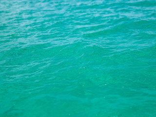 Turquoise blue seawater, lit by the midday sun