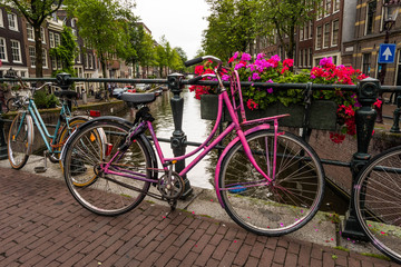 Fototapeta na wymiar Beautiful scenes of bikes parked on a bridge in Amsterdam, Holland.