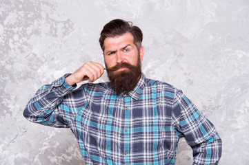 portrait of masculinity. Stylish fashionable man grunge background. Handsome man wearing checkered...