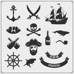 Set of pirate icons, emblems and design elements. Ship, anchor and Jolly Roger.