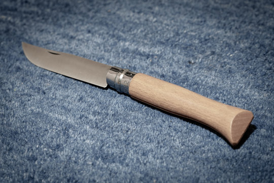 Photo of an opened No.12 Opinel vintage knife. Opinel knives are emblematic French working man's wooden folding pocket tool.