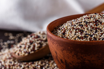 mix of quinoa grains on dark wooden rustic background