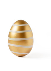 Golden colored easter egg isolated on white background. Happy Easter time.