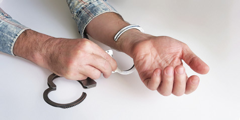 The criminal is released from prison.The acquittal was handed down to an innocent defendant. Hands...