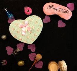 card female happiness gifts heart, jars, makeup products, in a romantic setting for Valentine's Day or birthday