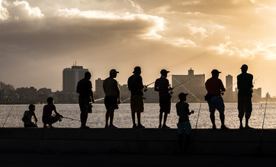 Fishing off the Malecon at sunset