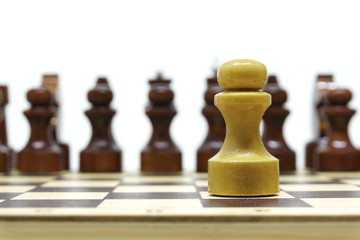 Chess, lone white pawn against enemies. Shallow DOF, focus on white pawn. Isolated on white.