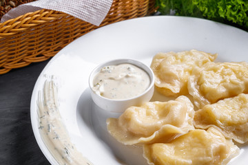 traditional Ukrainian dish of dumplings with sour cream
