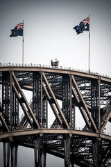 Australian flags fly over the Sydney Harbour Bridge