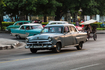 Taxis at dusk in Havana