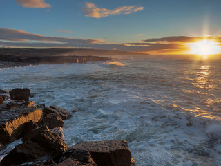 Sunset over Atlantic ocean, West coast of Ireland, Cloudy sky, Nobody, Sun flare ,Powerful waves.