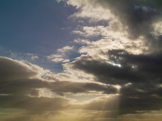 Obraz premium Blue dramatic sky with clouds, Abstract nature background. Sun rays.
