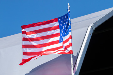 american flag over a blue sky