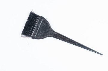 Old black hair dye brush isolated on white background. Copy space.