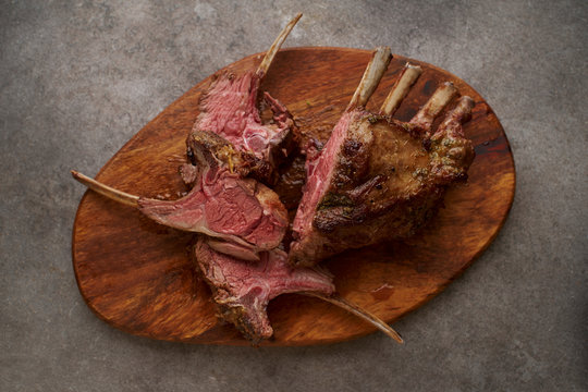 Roasted rack of lamb on cutting board