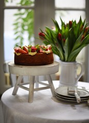 traditional English tea, high tea. Cake with berries and pudding.	