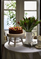 traditional English tea, high tea. Cake with berries and pudding.	