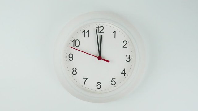 Twelve o'clock White wall clock face beginning of time 12.00 am. on White background.