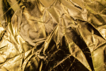 Photography light reflector texture. Golden color studio light reflector close-up shot.