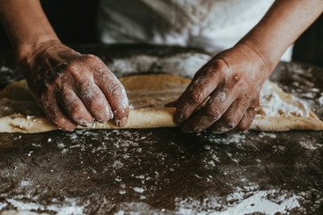 A Woman Prepares Homemade Braided Bread at Home