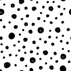 Dot doodles seamless pattern. Hand drawn circles texture. Dots background.